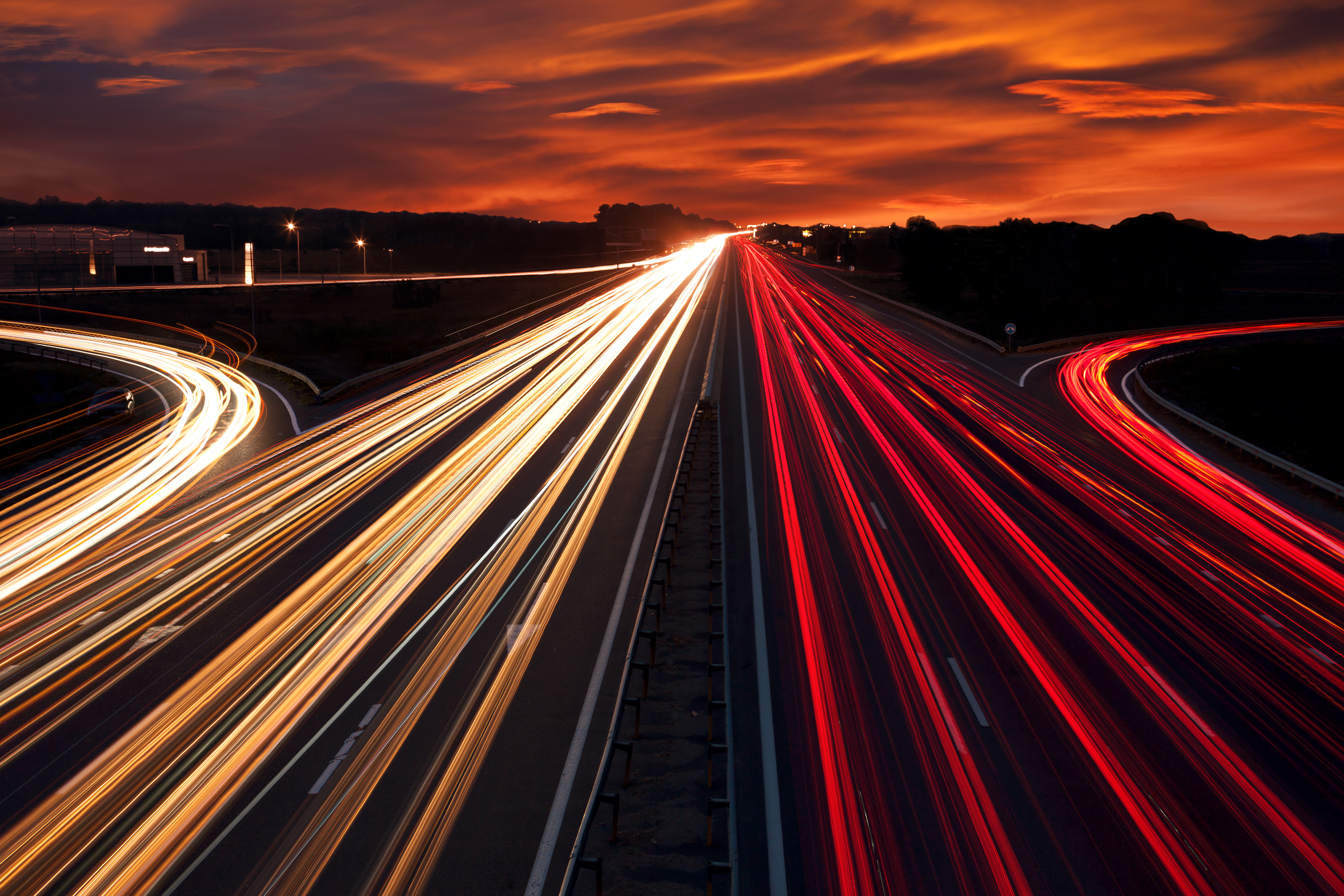 Speed Traffic - light trails on motorway highway at night, long exposure abstract urban background